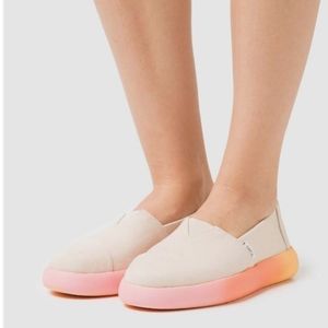 Toms Cream Canvas Slip-Ons with Pink to Orange Gradient Sole